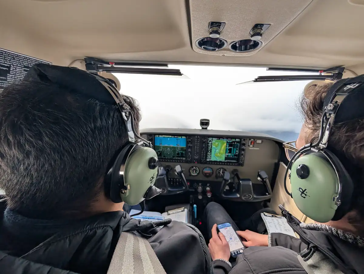 Instructor and student in a glass-cockpit trainer